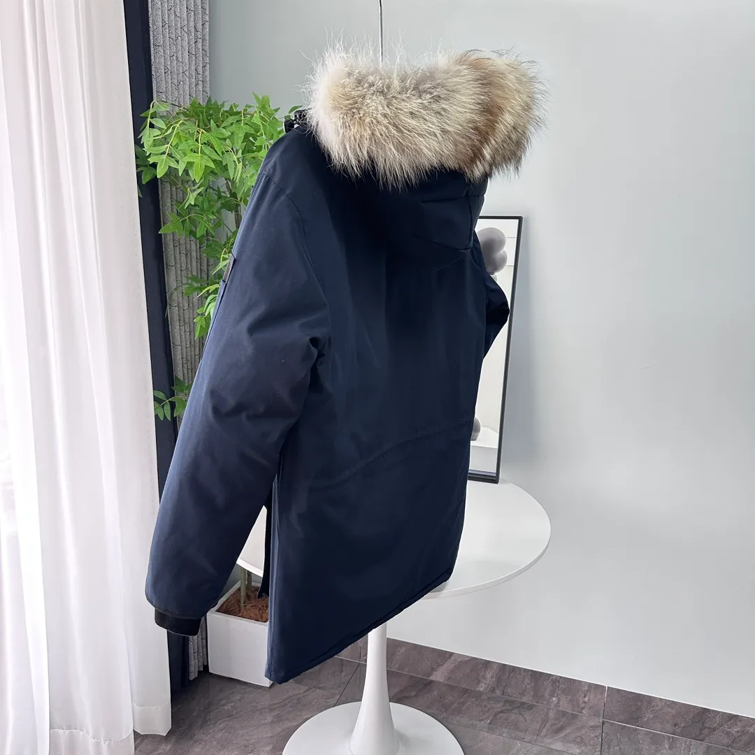 P700 CANADA GOOSE｜Canada Goose Expedition Parka｜Classic upgrade New 08 style Color: graphite gray, off-white, black, pink, navy blue, sky blue, Size: XS, S, M, L, XL, XXL, Product introduction Loose fit, multi-pocket design Larger size for free movement. 6 exterior pockets: 4 reversible front pockets, zippered side entry. There is a practical pocket on the left sleeve and a top pocket on the right sleeve. There is a drawstring on the inside of the waist and a logo patch on the back. The waist is designed with an inside drawstring, which can be adjusted to provide excellent warmth. Woven grab straps at upper back with “Expedition” logo patch • Hood with removable zipper trim, interchangeable hood trim for personalization and added protection (this jacket is not available with the classic hood trim) • Chin protection element has a tricot inner fabric for softness and comfort • Woven grab straps at upper back with “Expedition” logo patch • Internal drawstring at the waist, adjustable to provide excellent warmth •Snap-in rib knit cuffs for added comfort and optimal heat locking in •Stylish hanging inner straps allow the jacket to be carried over the shoulder, hands-free •Stowaway nylon stretch snow skirt for added protection •Two-way zipper covered fly with Velcro® snaps that unzips from the bottom for increased range of motion and breathability. A windproof fly is designed under the zipper for an extra layer of protection. • 6 exterior pockets: 4 two-way pockets on the front with top flap and Velcro® snaps, and zippered side entry. Utility pockets on left sleeve and right sleeve with top flap and velcro® snaps Internal pockets: 1 zipped pocket, 2 mesh drop-in pockets Embroidered Canada Goose logo